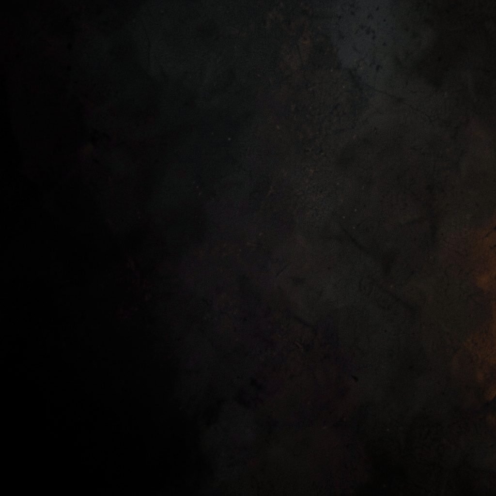 Dark atmospheric texture with subtle warm highlights