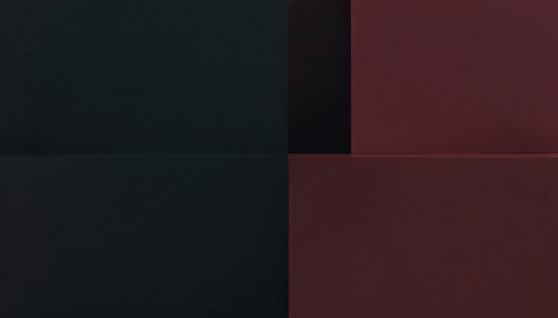 Deep charcoal and muted crimson abstract blocks