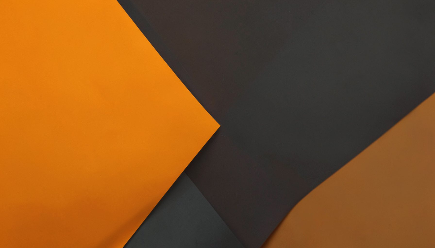 Warm amber and dark gray abstract geometric shapes